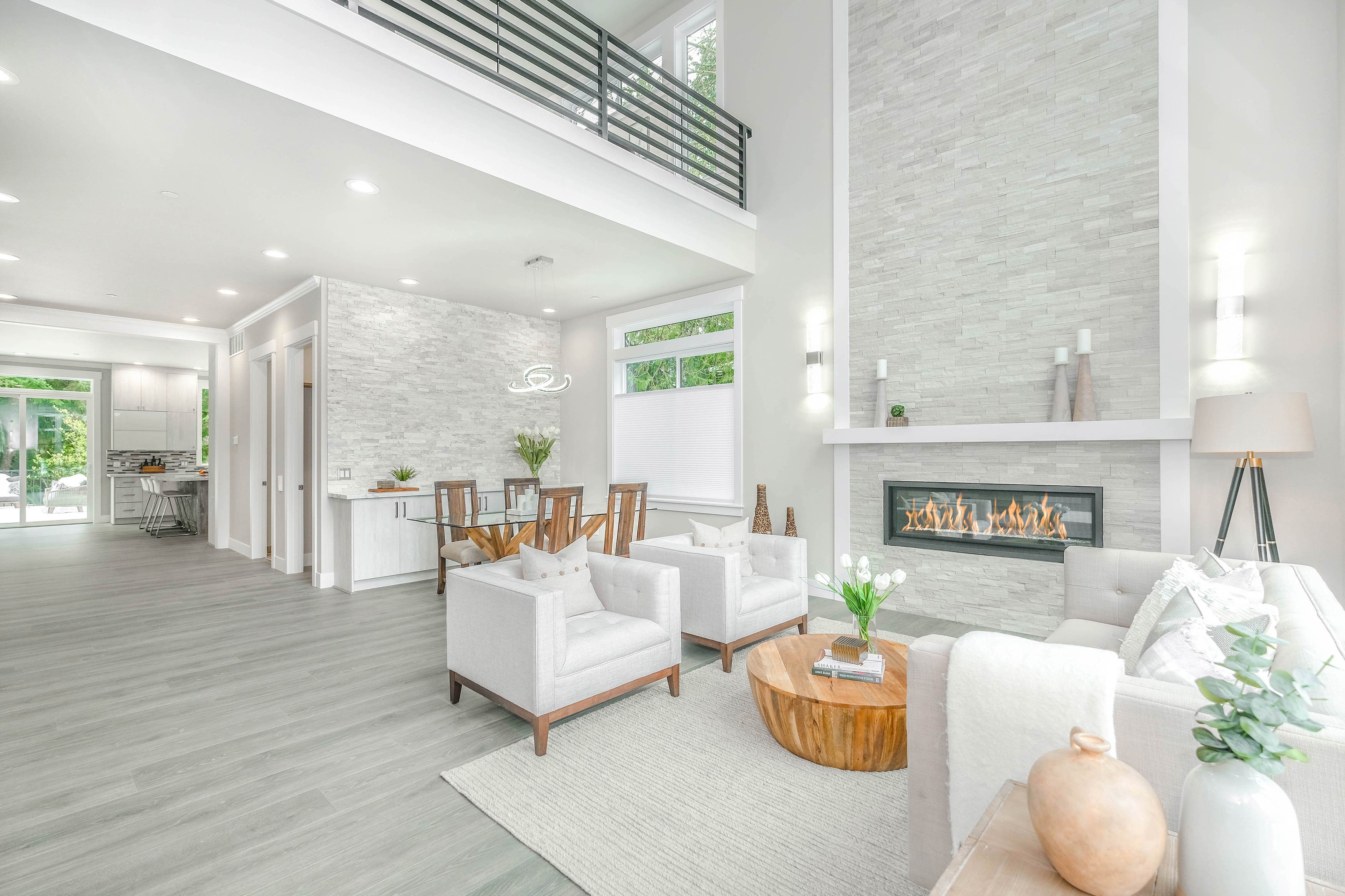 Modern guest room with fireplace, stacked stone walls and spc flooring