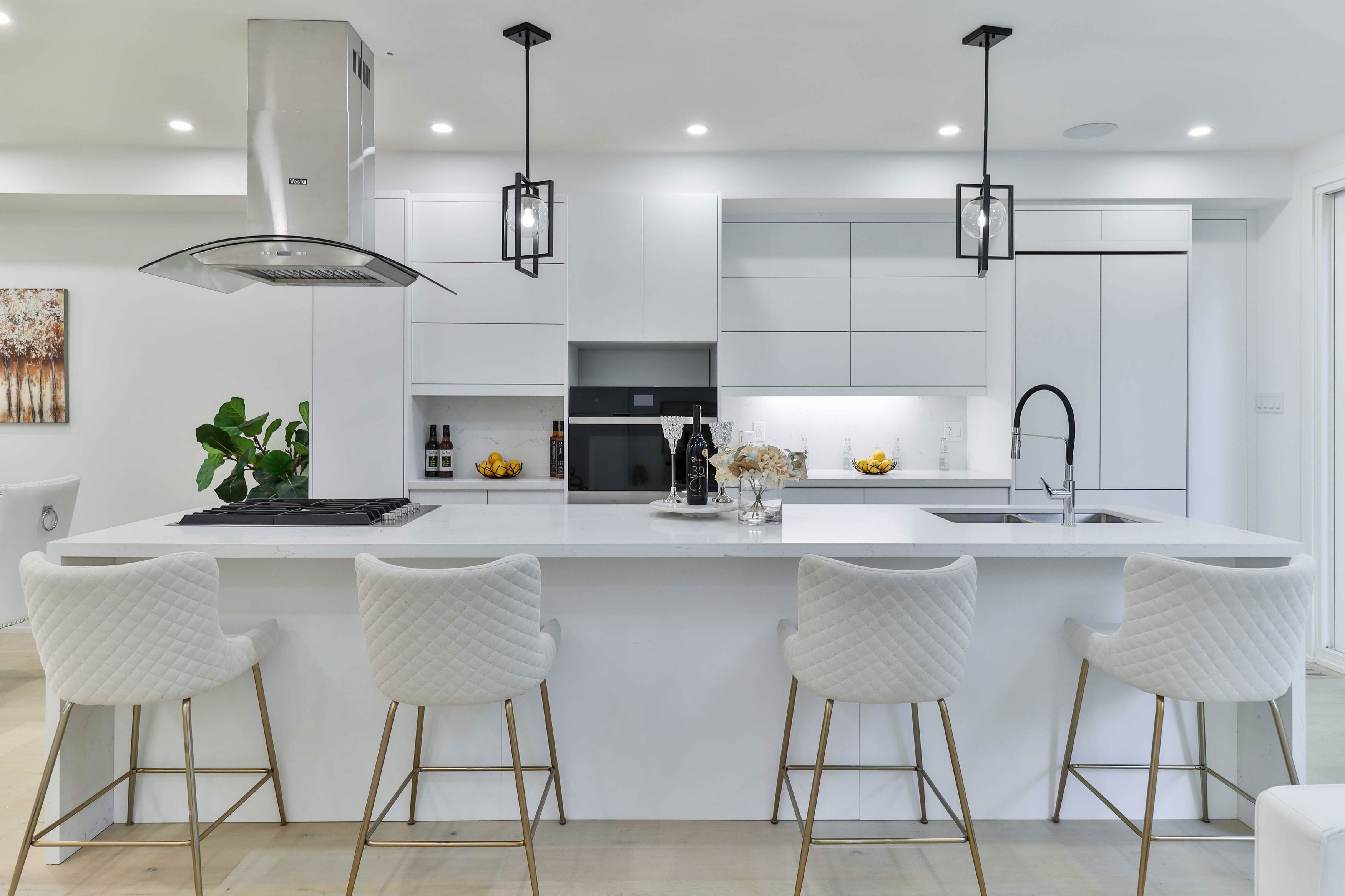 Modern kitchen with all white countertops and cabinets